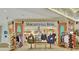 Margaritaville store featuring colorful displays of clothing, hats, and souvenirs, decorated with surfboards and Americana accents at 8044 Lost Shaker Ln, Kissimmee, FL 34747