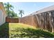 Fenced backyard with grass at 830 Grand Hughey Ct, Apopka, FL 32712