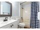 Bathroom featuring a shower-tub combo with a blue and white checkered shower curtain at 830 Grand Hughey Ct, Apopka, FL 32712