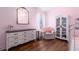 Bedroom with pink walls and a closet with glass doors at 830 Grand Hughey Ct, Apopka, FL 32712