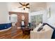 Comfortable living room featuring hardwood floors and modern decor at 830 Grand Hughey Ct, Apopka, FL 32712
