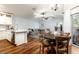 Inviting living room with hardwood floors, natural light, and comfortable seating area at 830 Grand Hughey Ct, Apopka, FL 32712
