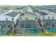 Aerial view of townhome featuring a screened pool and neighborhood at 9312 Sommerset Hills Dr, Davenport, FL 33896