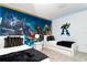 Themed bedroom with 'Transformers' decor, featuring two twin beds and vibrant wall art at 9312 Sommerset Hills Dr, Davenport, FL 33896