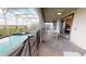 Spacious screened patio with a pool, jacuzzi, outdoor dining set, and comfortable lounge chairs at 9312 Sommerset Hills Dr, Davenport, FL 33896