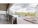 Inviting screened pool area with lounge chairs, a jacuzzi, and open views of the surrounding landscape at 9312 Sommerset Hills Dr, Davenport, FL 33896