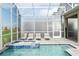Relaxing pool and spa area with ample lounge seating for enjoying sunny days at 9312 Sommerset Hills Dr, Davenport, FL 33896