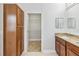 Bathroom featuring a granite countertop vanity, a walk-in closet, and tile flooring at 1013 Maiden Ter, Celebration, FL 34747