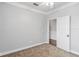 Neutral bedroom featuring plush carpet, bright trim, ceiling fan and an open closet at 1013 Maiden Ter, Celebration, FL 34747