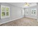 Well-lit bedroom with plantation shutters, neutral walls and carpet, plus a ceiling fan at 1013 Maiden Ter, Celebration, FL 34747