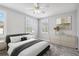 Bedroom with neutral colors, large windows, and coordinated furniture at 1013 Maiden Ter, Celebration, FL 34747