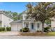Charming two-story home with a welcoming porch, neat landscaping, and a convenient two-car garage at 1013 Maiden Ter, Celebration, FL 34747