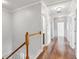 Upstairs hallway featuring hardwood floors, white trim, and recessed lighting at 1013 Maiden Ter, Celebration, FL 34747