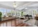 Bright living room featuring hardwood floors, lots of natural light, and stylish furniture at 1013 Maiden Ter, Celebration, FL 34747