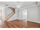 Living area featuring hardwood floors, neutral walls, and stairway to the upper level at 1013 Maiden Ter, Celebration, FL 34747