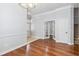 An open room featuring hardwood floors, an entry way and an open doorway to another room with french doors at 1013 Maiden Ter, Celebration, FL 34747