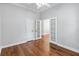 A bright office space featuring hardwood floors, french doors, crown moulding, and white trim at 1013 Maiden Ter, Celebration, FL 34747