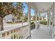 Inviting porch with white railings offers a pleasant view of the street and neighborhood at 1013 Maiden Ter, Celebration, FL 34747