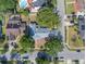 Aerial view of the home showcasing the backyard, mature trees and neighborhood in a desirable residential community at 1030 Gran Paseo Dr, Orlando, FL 32825