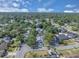 Aerial view of a leafy neighborhood with single Gathering homes, mature trees and well-maintained lawns on a sunny day at 1030 Gran Paseo Dr, Orlando, FL 32825