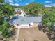 Aerial view showcasing the home's layout, roof, and surrounding landscape in a peaceful neighborhood setting at 1030 Gran Paseo Dr, Orlando, FL 32825