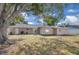 Spacious backyard with mature trees and well-maintained lawn at 1030 Gran Paseo Dr, Orlando, FL 32825