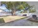 Backyard featuring a mature tree and white privacy fence at 1030 Gran Paseo Dr, Orlando, FL 32825