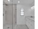 Modern bathroom with a glass-enclosed shower, sleek vanity, and clean white finishes offering a spa-like feel at 1030 Gran Paseo Dr, Orlando, FL 32825