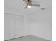 This bedroom is bright and airy, and features a ceiling fan and modern closet at 1030 Gran Paseo Dr, Orlando, FL 32825