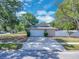 Well-maintained home with a two-car garage and attractive landscaping at 1030 Gran Paseo Dr, Orlando, FL 32825