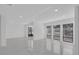 Spacious living room with multiple windows, and modern white floors at 1030 Gran Paseo Dr, Orlando, FL 32825