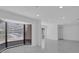 Bright living room featuring a large bay window, white walls, and sleek flooring at 1030 Gran Paseo Dr, Orlando, FL 32825