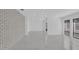 Large living room featuring a brick accent wall and bright windows at 1030 Gran Paseo Dr, Orlando, FL 32825