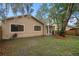 A nice backyard with a well-maintained lawn and a covered area, perfect for outdoor gatherings at 1105 Mill Run Cir, Apopka, FL 32703