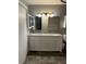 Updated bathroom with double sinks, granite countertop, modern fixtures, and ample storage space at 1105 Mill Run Cir, Apopka, FL 32703