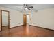 Bedroom features wood floors and ceiling fan at 1105 Mill Run Cir, Apopka, FL 32703