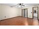 Bedroom includes wood floors, ceiling fan and sliding glass door at 1105 Mill Run Cir, Apopka, FL 32703