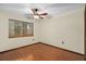 Bedroom includes wood floors, ceiling fan and window at 1105 Mill Run Cir, Apopka, FL 32703