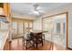 Bright dining room with a modern light fixture, breakfast nook, and sliding glass door at 1105 Mill Run Cir, Apopka, FL 32703