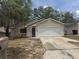 Charming single-story home with a two-car garage, lovely yard and mature trees at 1105 Mill Run Cir, Apopka, FL 32703