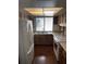 Functional kitchen featuring wooden cabinets, white appliances, ample counter space, and modern light fixtures at 1105 Mill Run Cir, Apopka, FL 32703
