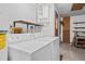 Bright laundry room with washer, dryer, and convenient shelving for storage solutions at 1105 Mill Run Cir, Apopka, FL 32703