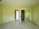 Bright bedroom with sliding closet doors and tiled floor for easy maintenance at 132 Acapulco Dr, Kissimmee, FL 34743