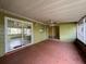 Enclosed patio with ceiling fan and sliding glass doors to the backyard and house at 132 Acapulco Dr, Kissimmee, FL 34743