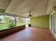 Enclosed patio featuring a ceiling fan and view of the backyard at 132 Acapulco Dr, Kissimmee, FL 34743