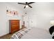 Bedroom featuring wood floors, white walls, ceiling fan, and modern decor at 1424 W New Hampshire St, Orlando, FL 32804