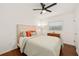 Bedroom with wood floors, a ceiling fan, a neutral color scheme, and a window at 1424 W New Hampshire St, Orlando, FL 32804