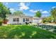 Bright one story home with a well maintained front yard and blue skies at 1424 W New Hampshire St, Orlando, FL 32804