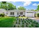 Charming single-story home with manicured lawn and white painted brick at 1424 W New Hampshire St, Orlando, FL 32804
