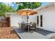 Outdoor patio featuring a dining set with seating for six and a large umbrella at 1424 W New Hampshire St, Orlando, FL 32804